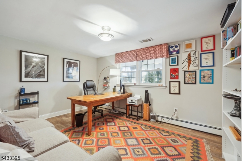 48 Woodmont Road Montclair, NJ 07043 - Photo 12 of 20 a living room with furniture a rug and a window