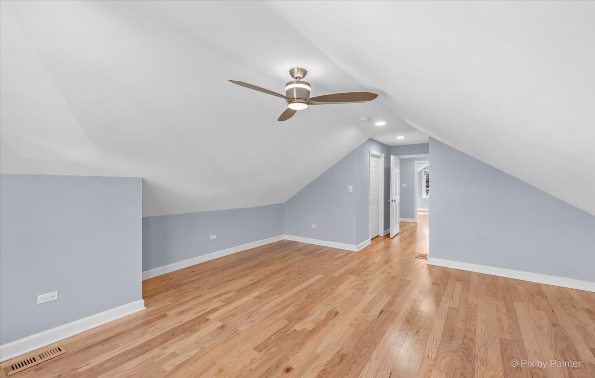 1902 South 9th Avenue Maywood, IL 60153 - Photo 12 of 51 a view of empty room with wooden floor and fan