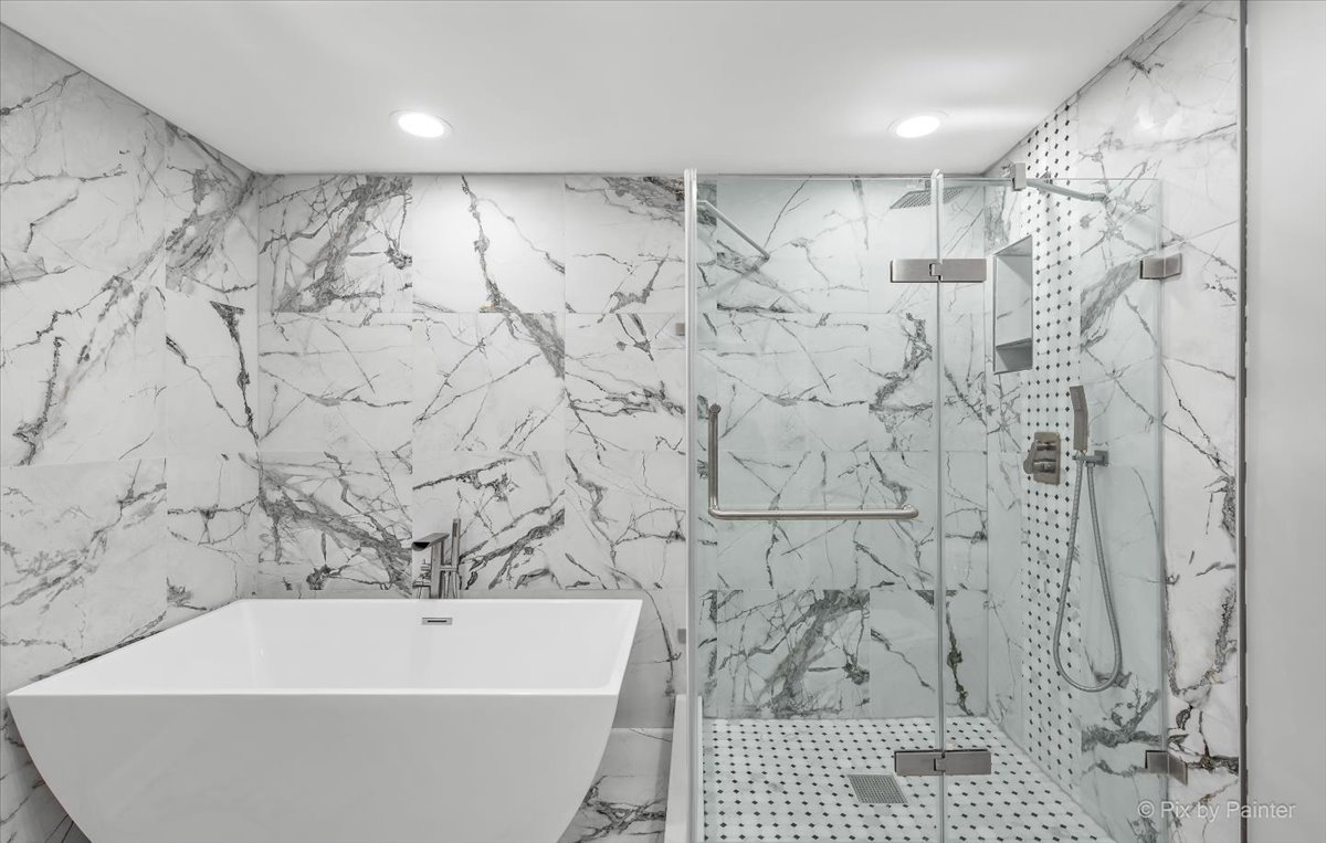 1902 South 9th Avenue Maywood, IL 60153 - Photo 14 of 51 a bathroom with a bathtub and shower