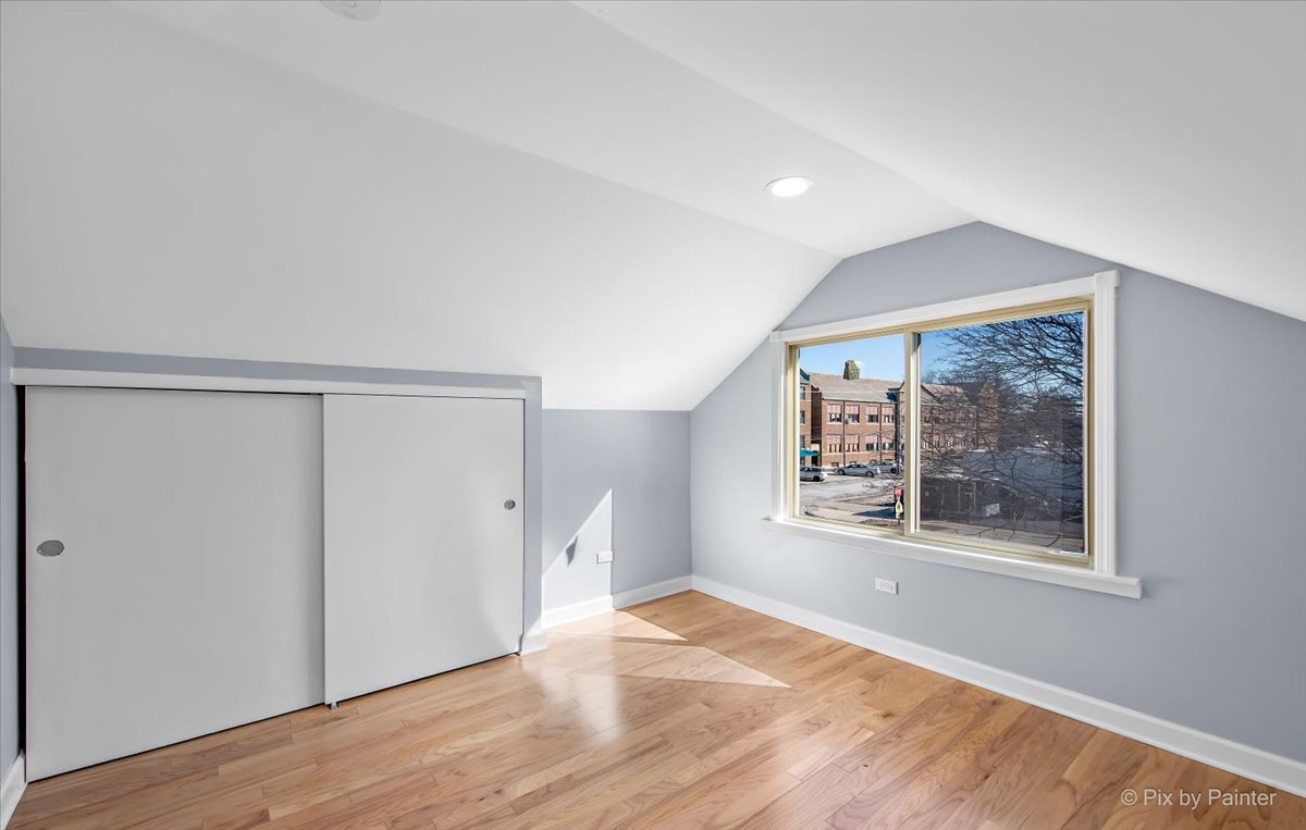 1902 South 9th Avenue Maywood, IL 60153 - Photo 17 of 51 an empty room with wooden floor and windows