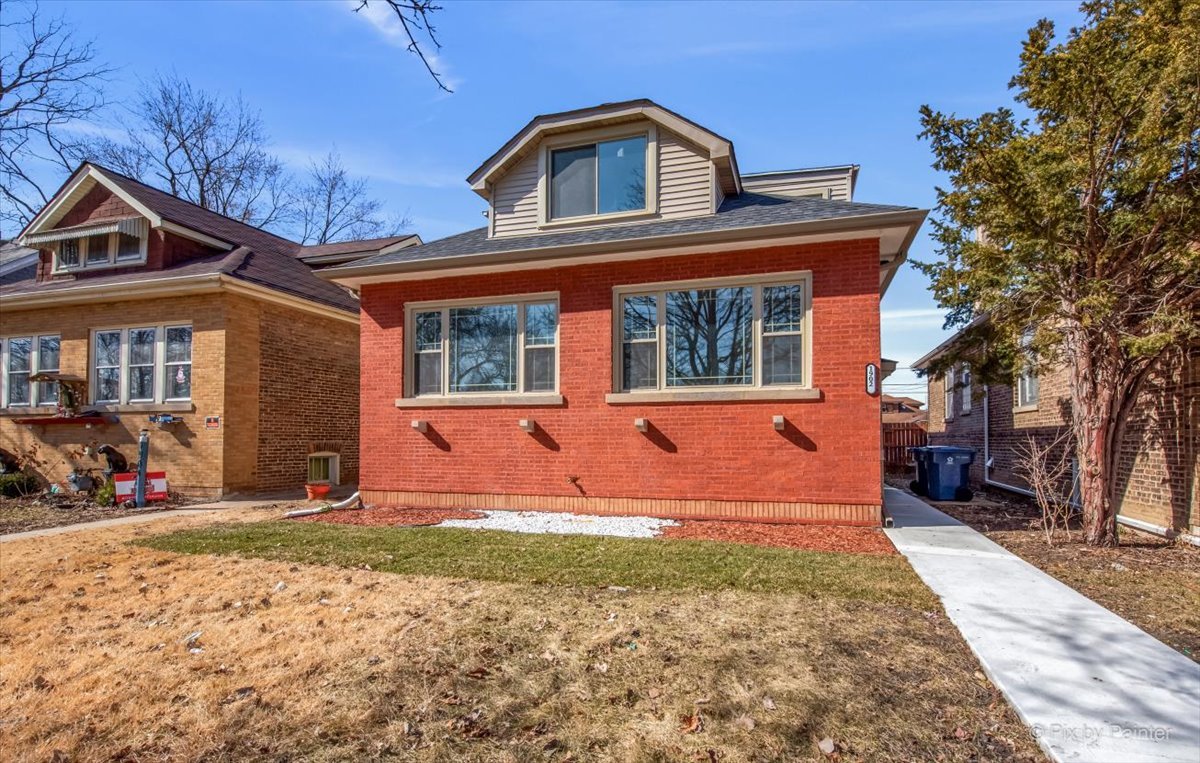 1902 South 9th Avenue Maywood, IL 60153 - Photo 2 of 51 a front view of a house with large yard