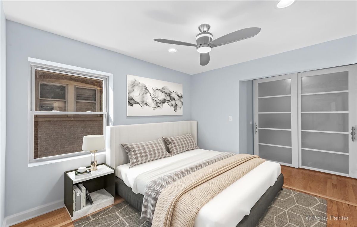 1902 South 9th Avenue Maywood, IL 60153 - Photo 21 of 51 a bedroom with a large bed and a window