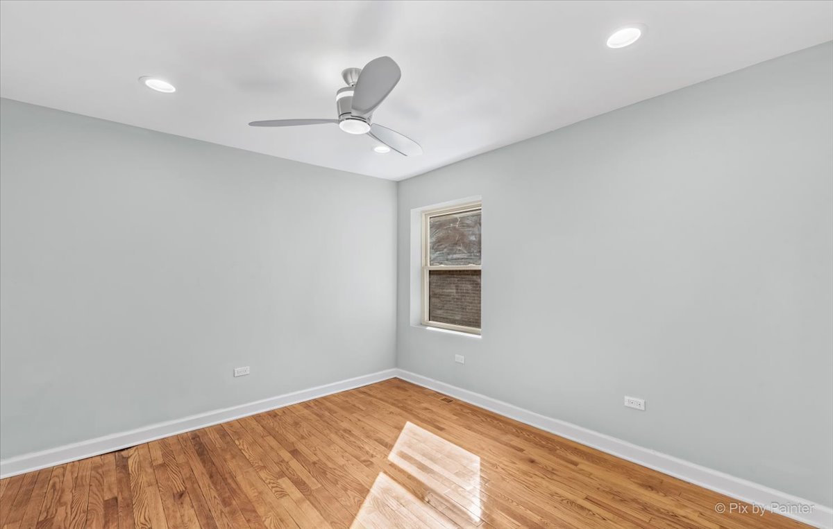 1902 South 9th Avenue Maywood, IL 60153 - Photo 24 of 51 an empty room with a window and ceiling fan