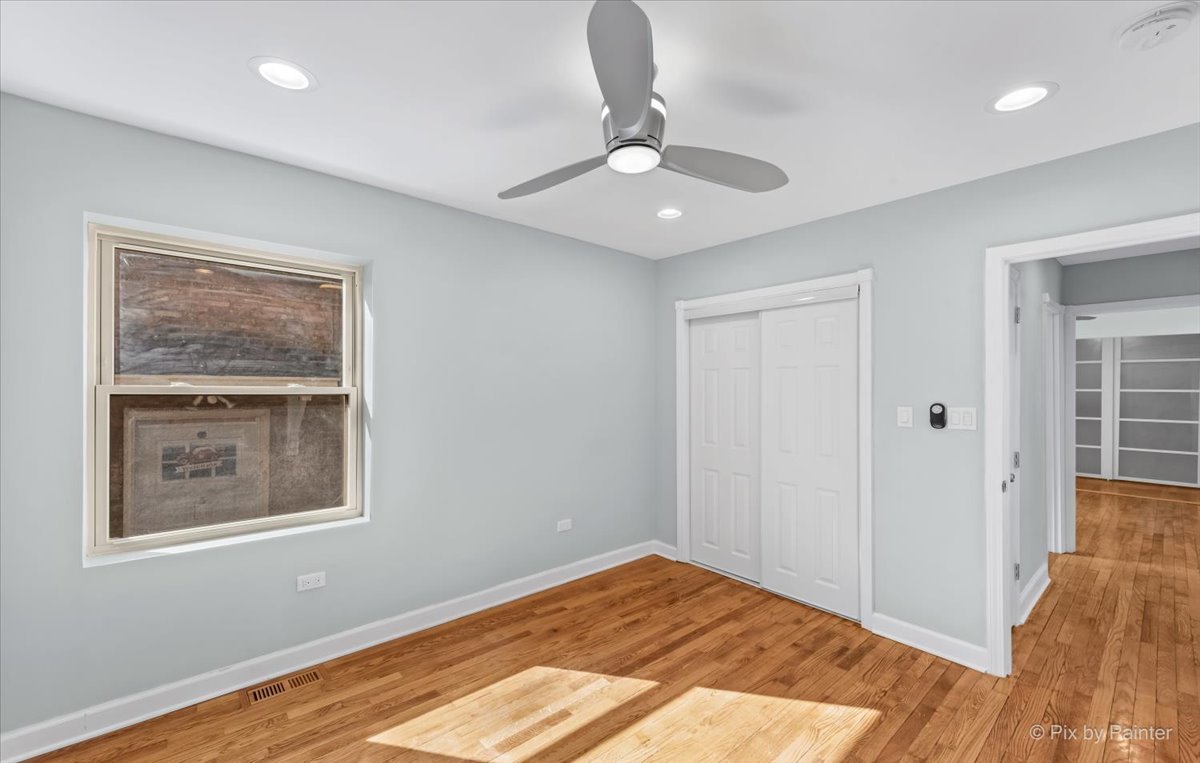 1902 South 9th Avenue Maywood, IL 60153 - Photo 25 of 51 a view of an empty room with wooden floor and a window