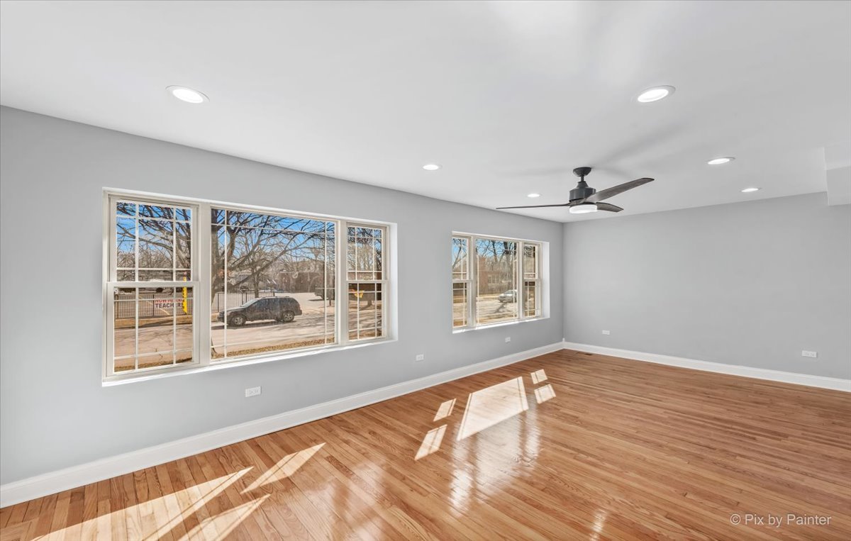 1902 South 9th Avenue Maywood, IL 60153 - Photo 26 of 51 a view of empty room with wooden floor and fan