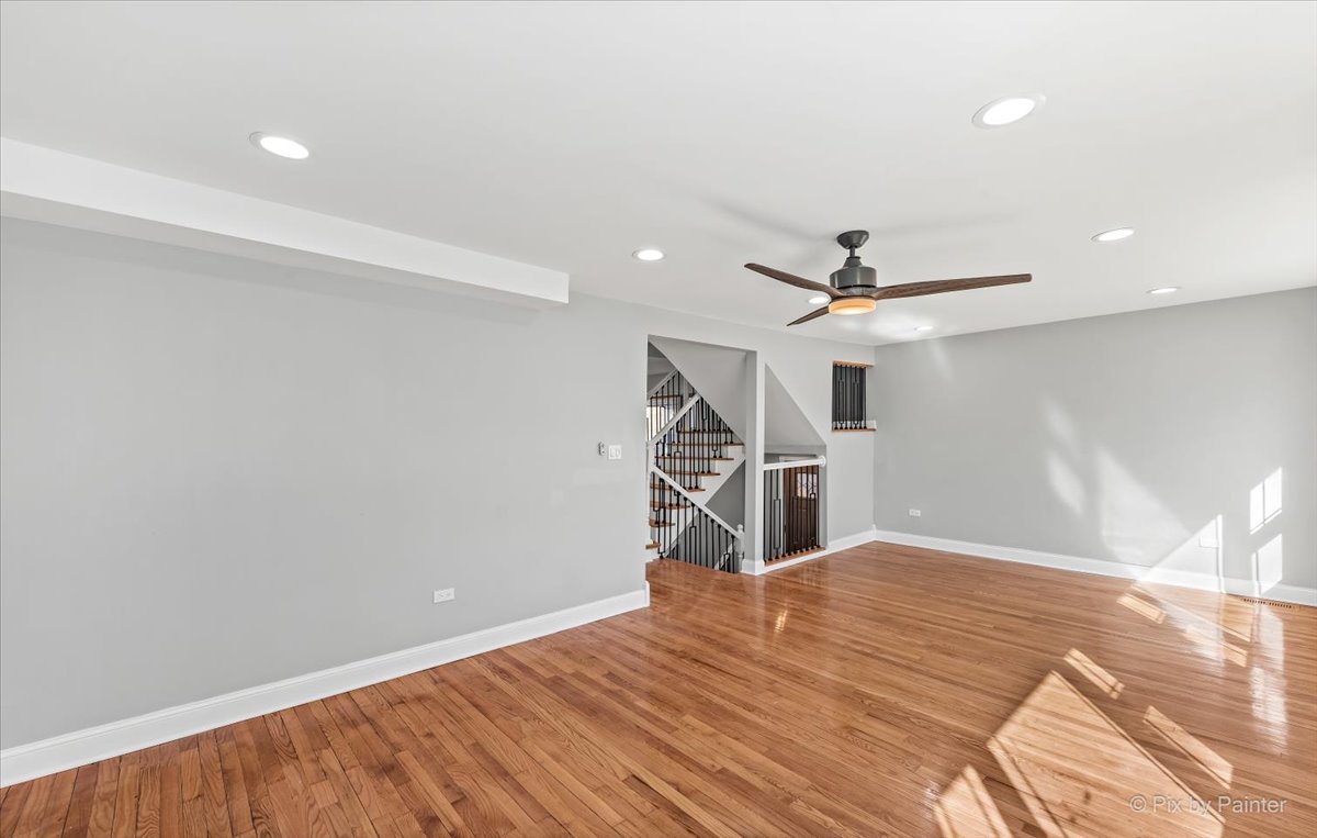 1902 South 9th Avenue Maywood, IL 60153 - Photo 28 of 51 a bedroom with a bed and a ceiling fan
