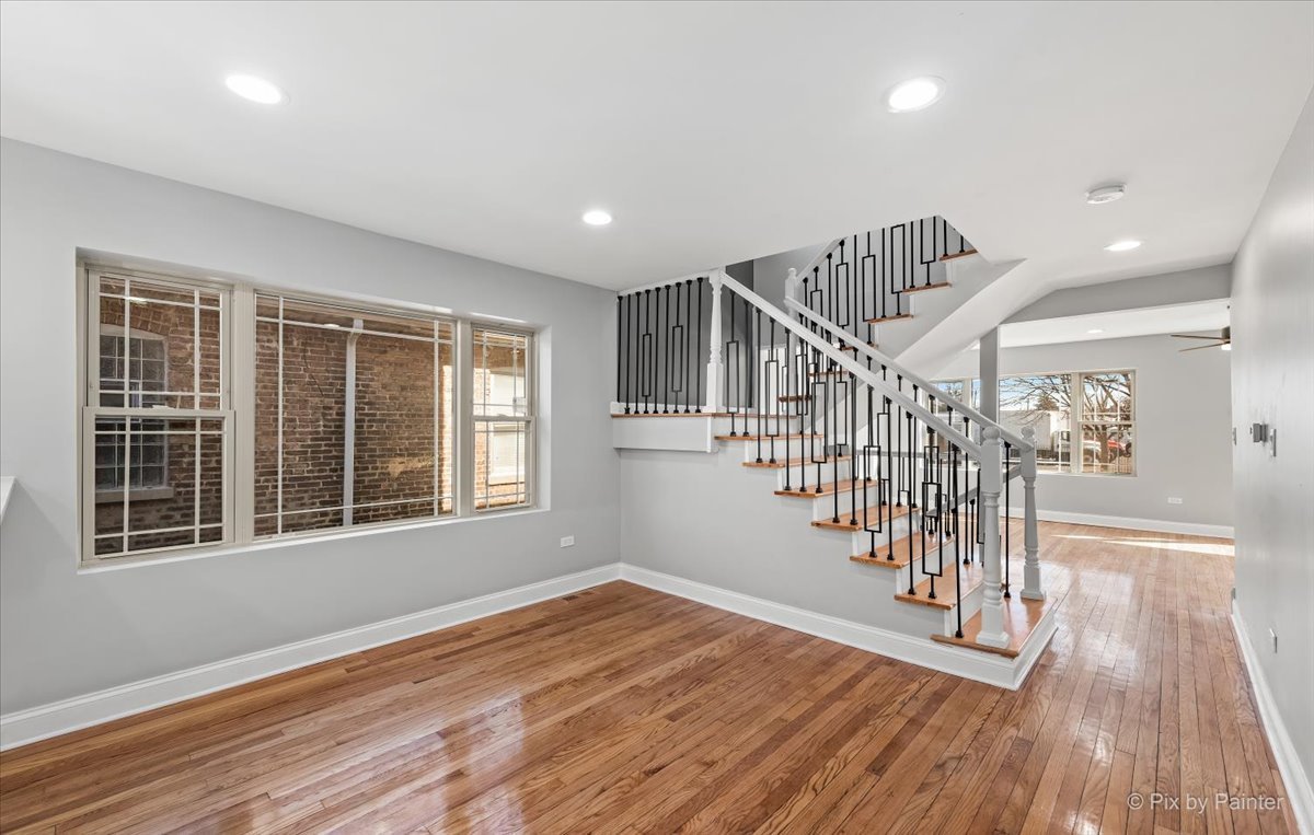 1902 South 9th Avenue Maywood, IL 60153 - Photo 29 of 51 a view of empty room with wooden floor and fan