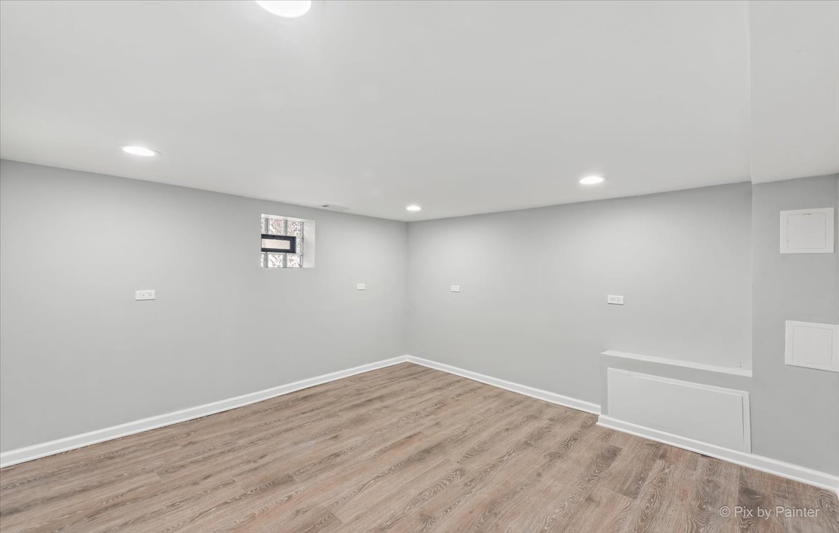 1902 South 9th Avenue Maywood, IL 60153 - Photo 30 of 51 a view of room with wooden floor and windows