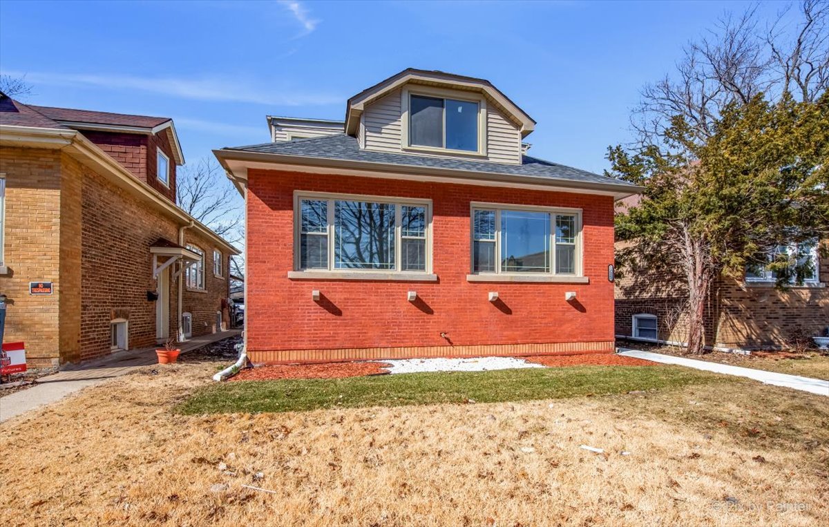 1902 South 9th Avenue Maywood, IL 60153 - Photo 3 of 51 a front view of a house with a yard