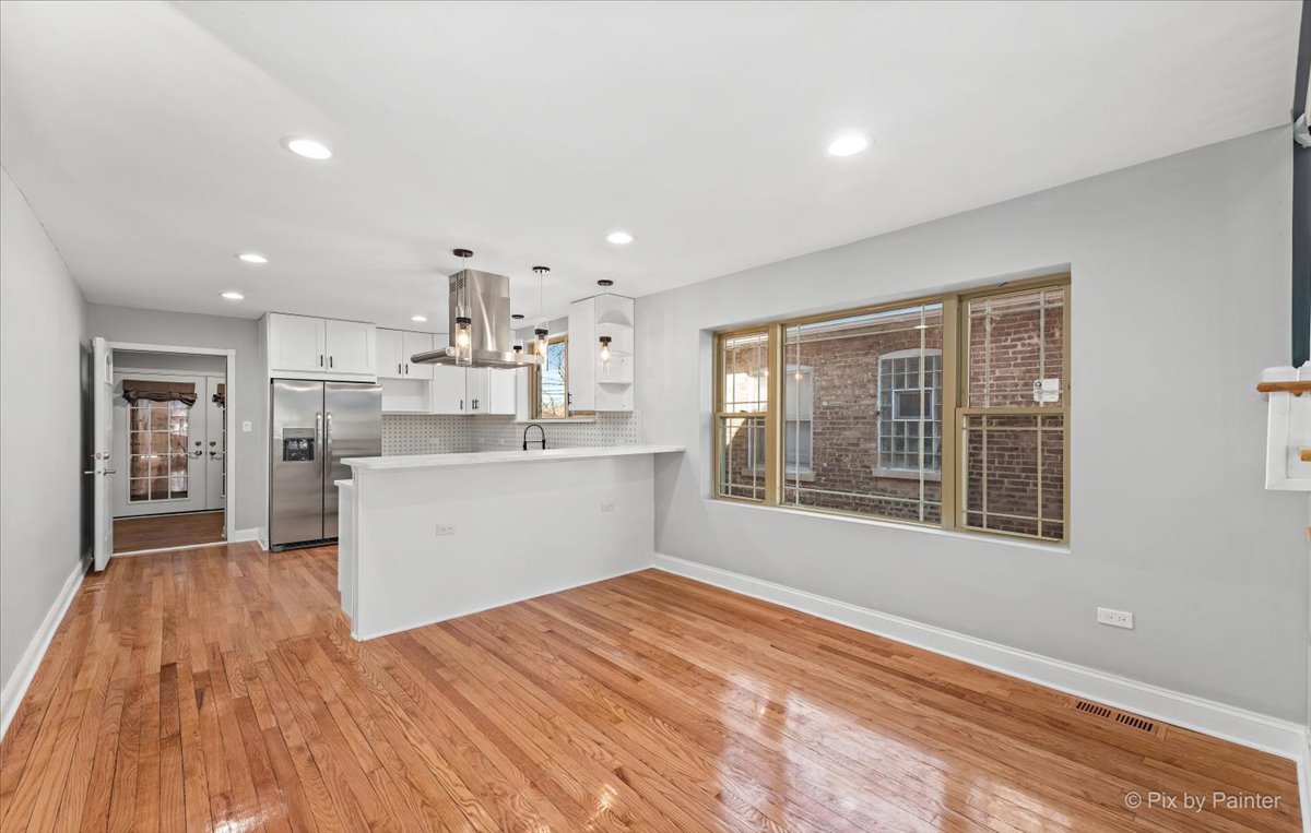 1902 South 9th Avenue Maywood, IL 60153 - Photo 5 of 51 a view of a kitchen with wooden floor and electronic appliances