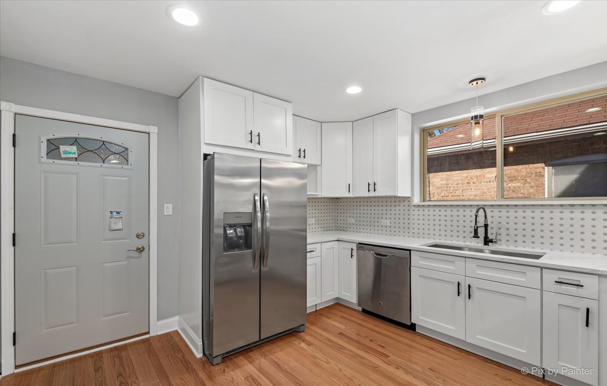 1902 South 9th Avenue Maywood, IL 60153 - Photo 7 of 51 a kitchen with a refrigerator sink and cabinets