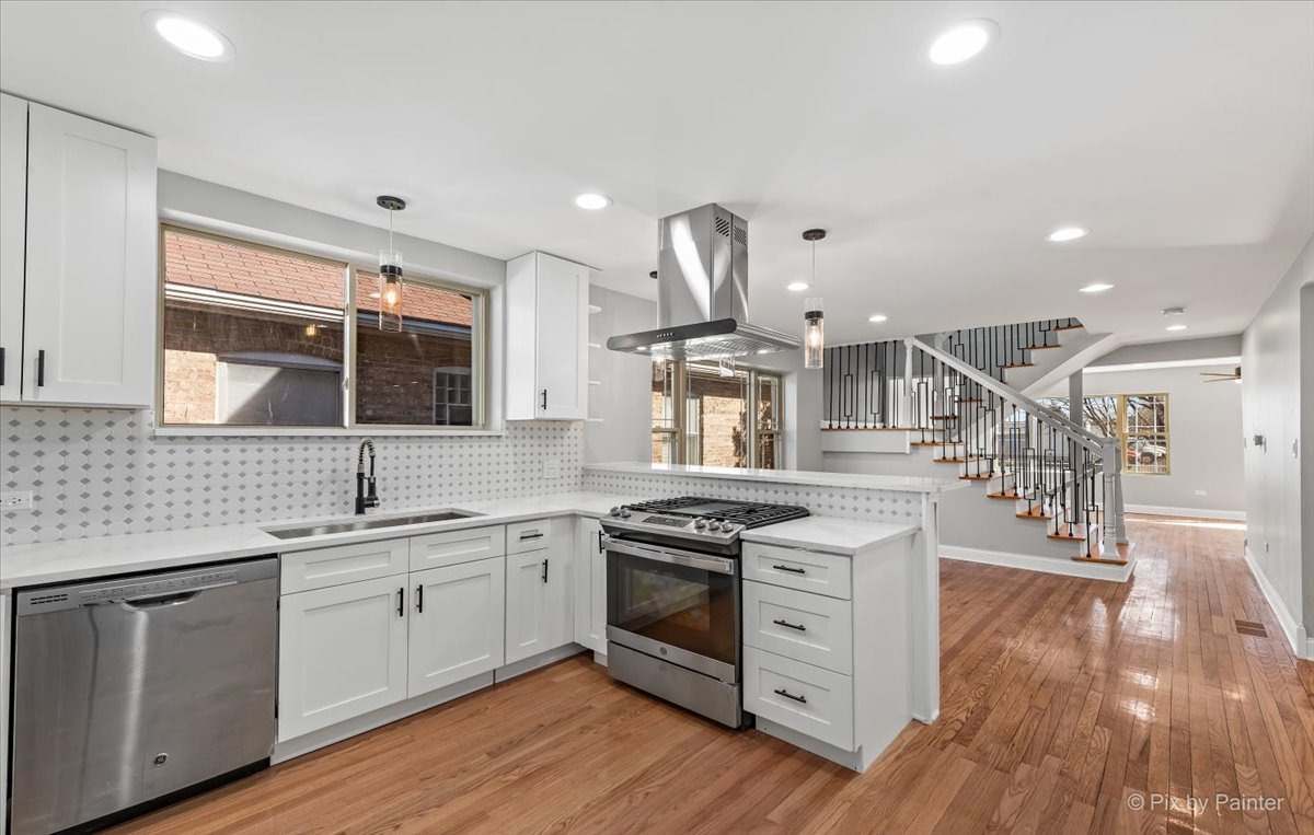 1902 South 9th Avenue Maywood, IL 60153 - Photo 8 of 51 a kitchen with a sink stove and cabinets