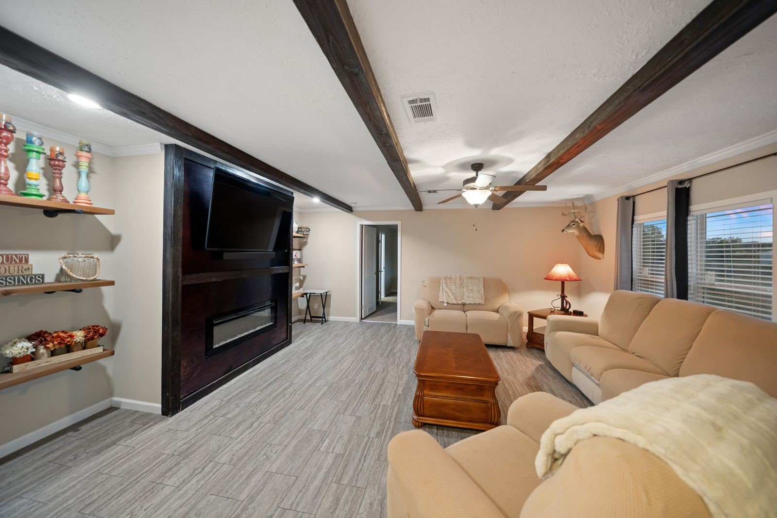 186 Fcr 941 Teague, TX 75860 - Photo 17 of 34 a living room with furniture flat screen tv and a fireplace