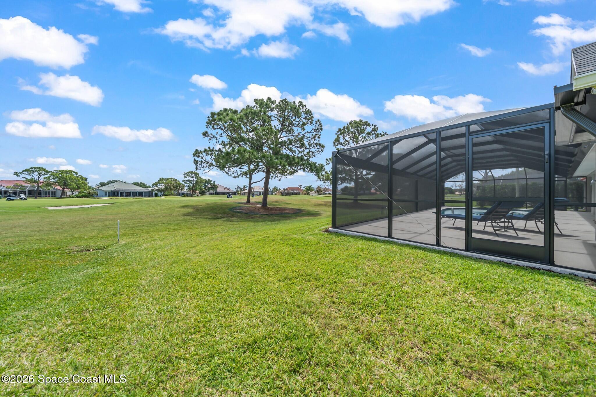 697 Spring Lake Drive Melbourne, FL 32940 - Photo 33 of 45 a view of a field with sitting area