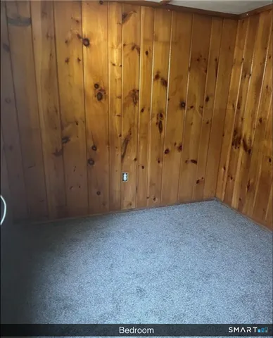 a bathroom with a toilet and a bathtub