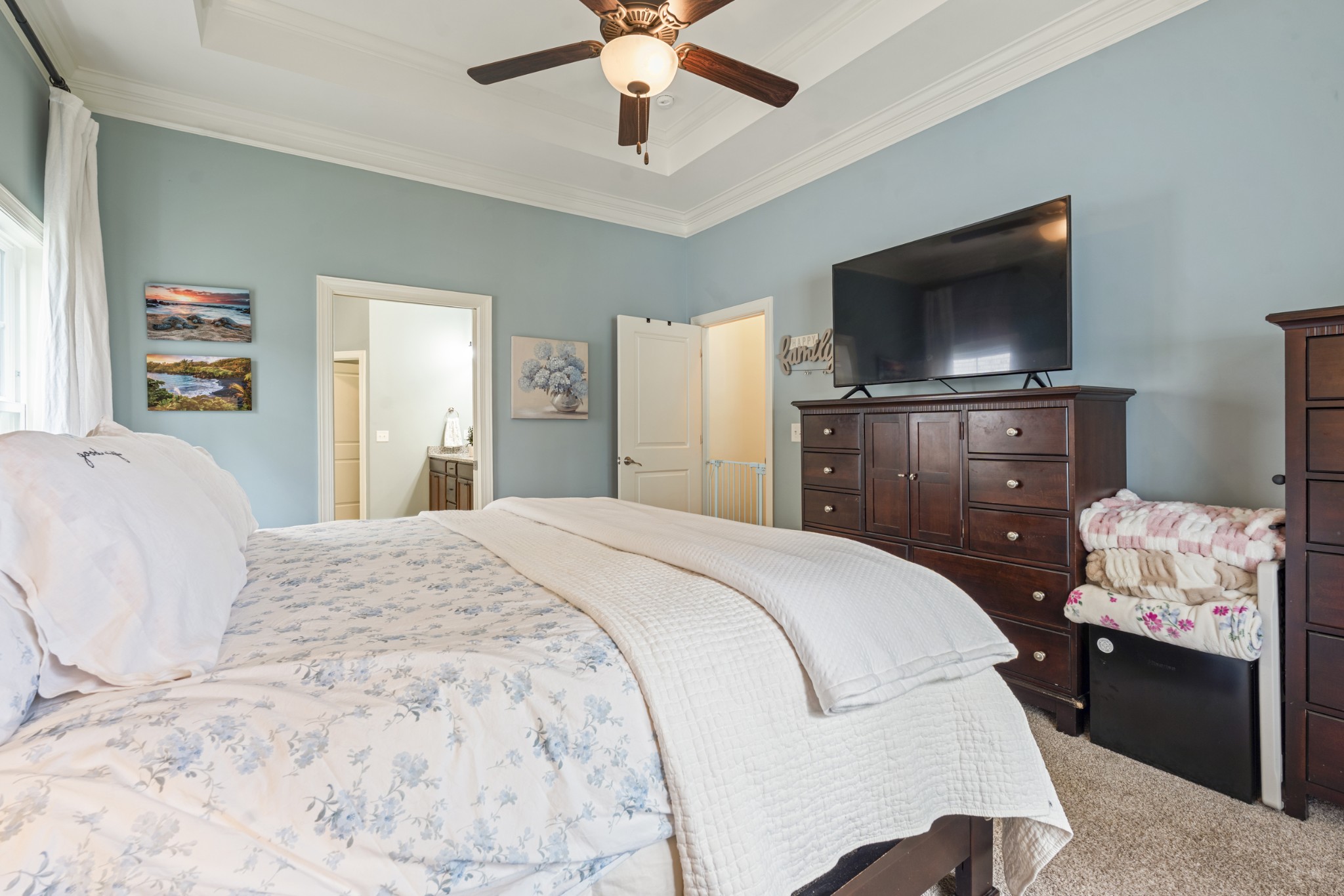 3433 Cortona Way Murfreesboro, TN 37129 - Photo 15 of 32 a bedroom with a bed and a flat screen tv