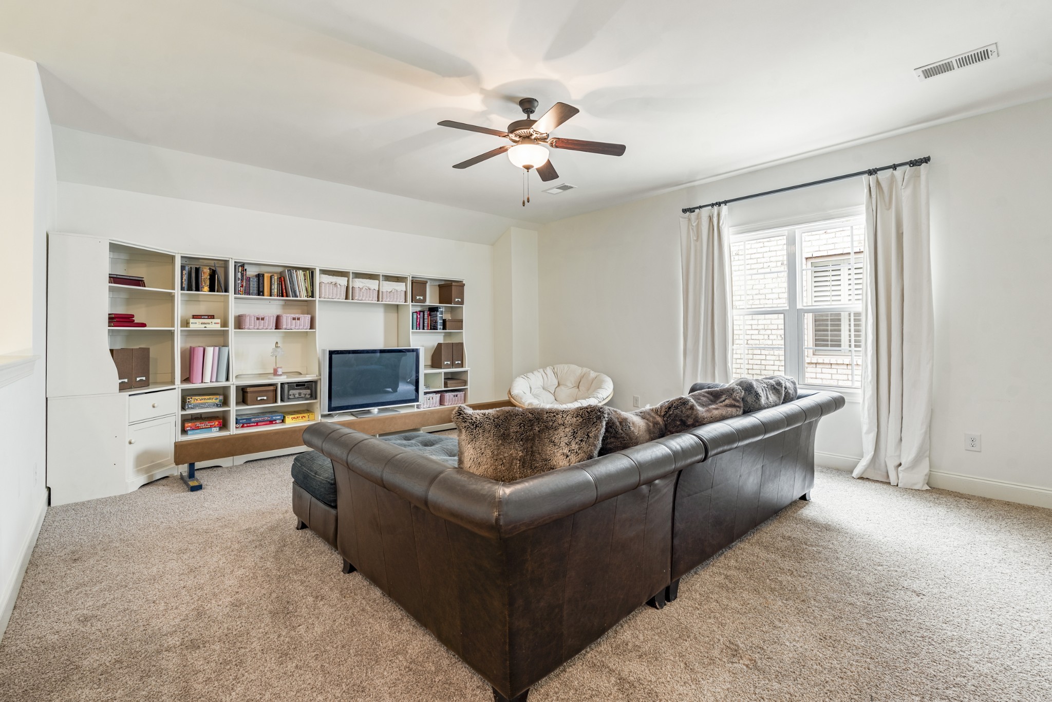 3433 Cortona Way Murfreesboro, TN 37129 - Photo 21 of 32 a living room with furniture and a fireplace