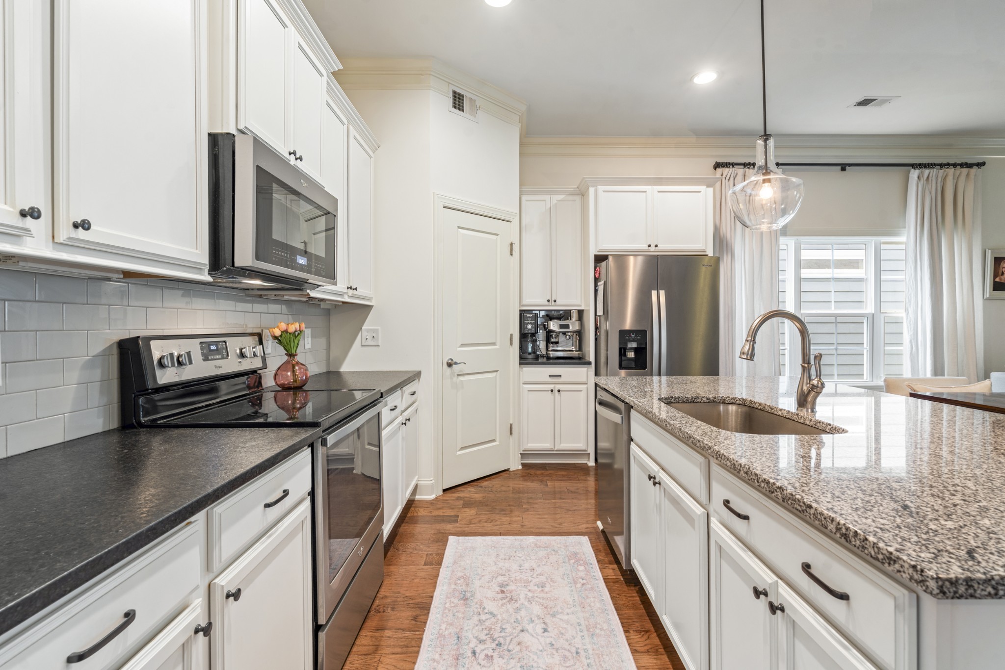 3433 Cortona Way Murfreesboro, TN 37129 - Photo 5 of 32 a kitchen with stainless steel appliances granite countertop a sink stove and refrigerator