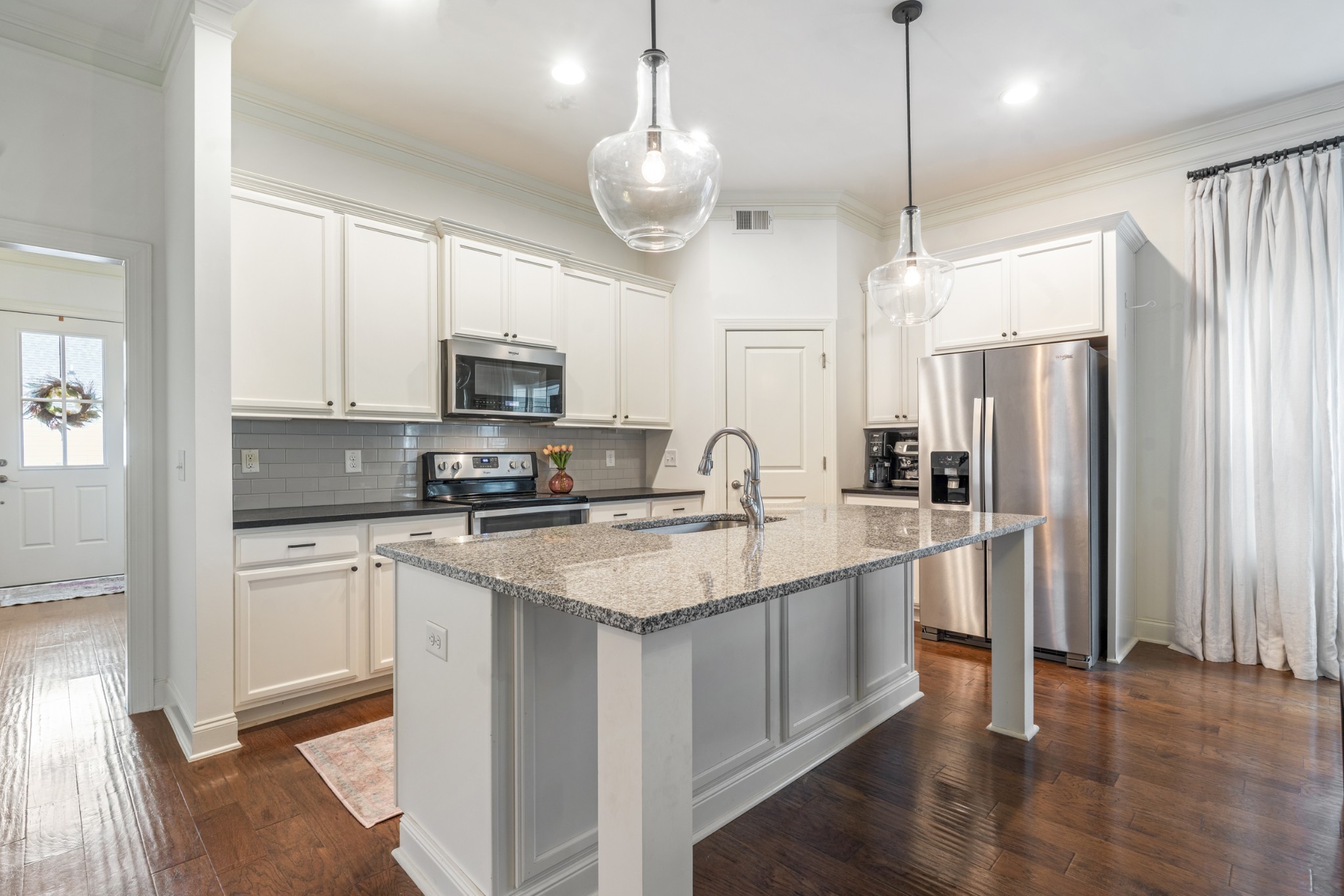 3433 Cortona Way Murfreesboro, TN 37129 - Photo 9 of 32 a kitchen with a sink stainless steel appliances and white cabinets