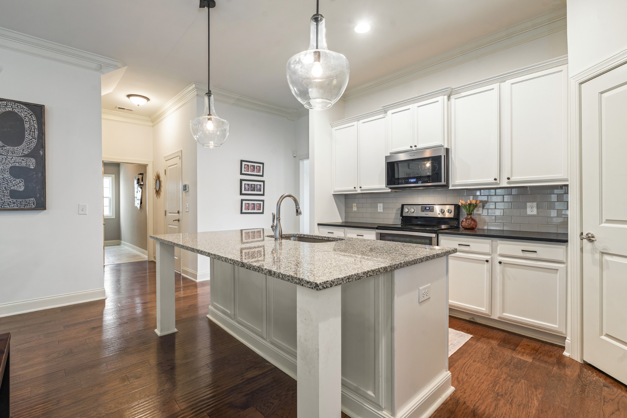 3433 Cortona Way Murfreesboro, TN 37129 - Photo 10 of 32 a kitchen with stainless steel appliances granite countertop a sink refrigerator and microwave