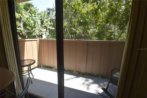 a view of a porch with a yard