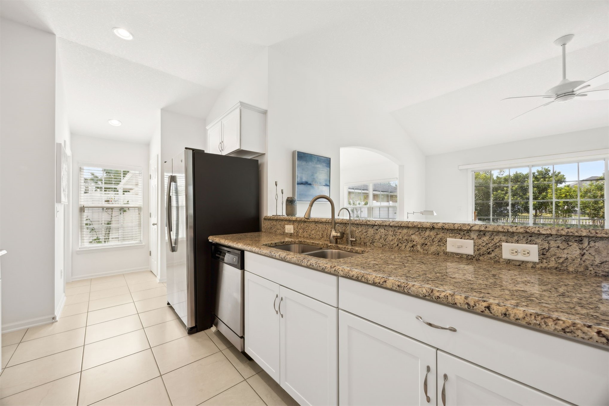 94037 Last Lane Yulee, FL 32097 - Photo 8 of 38 a kitchen with stainless steel appliances granite countertop a refrigerator and a sink