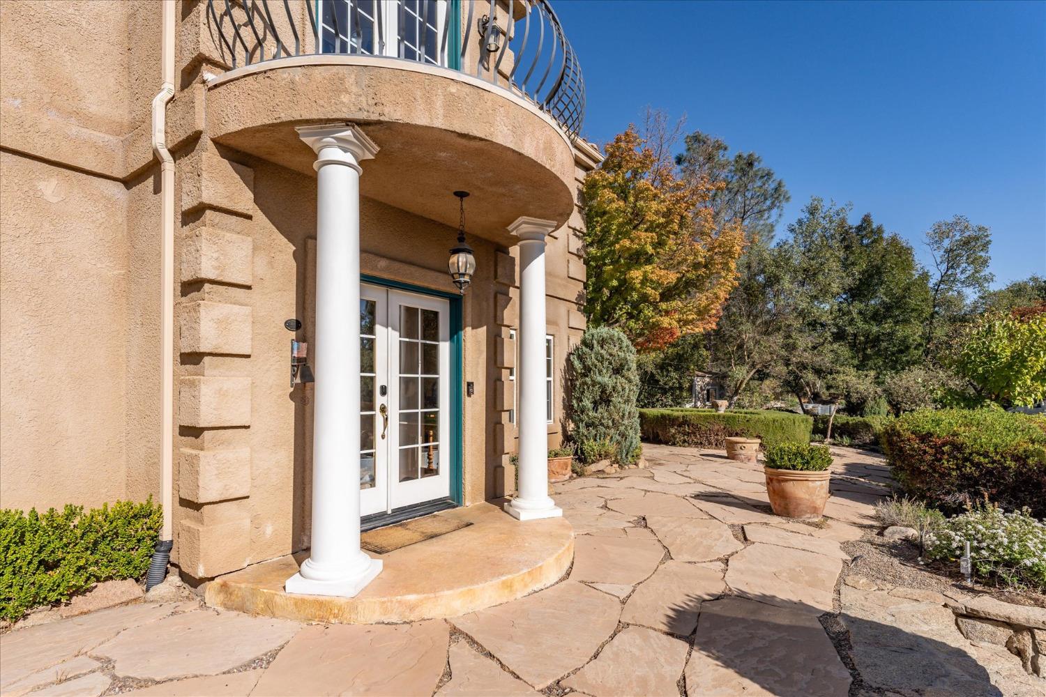 28853 Limestone Way Coarsegold, CA 93614 - Photo 11 of 54 a front view of a house with outdoor seating