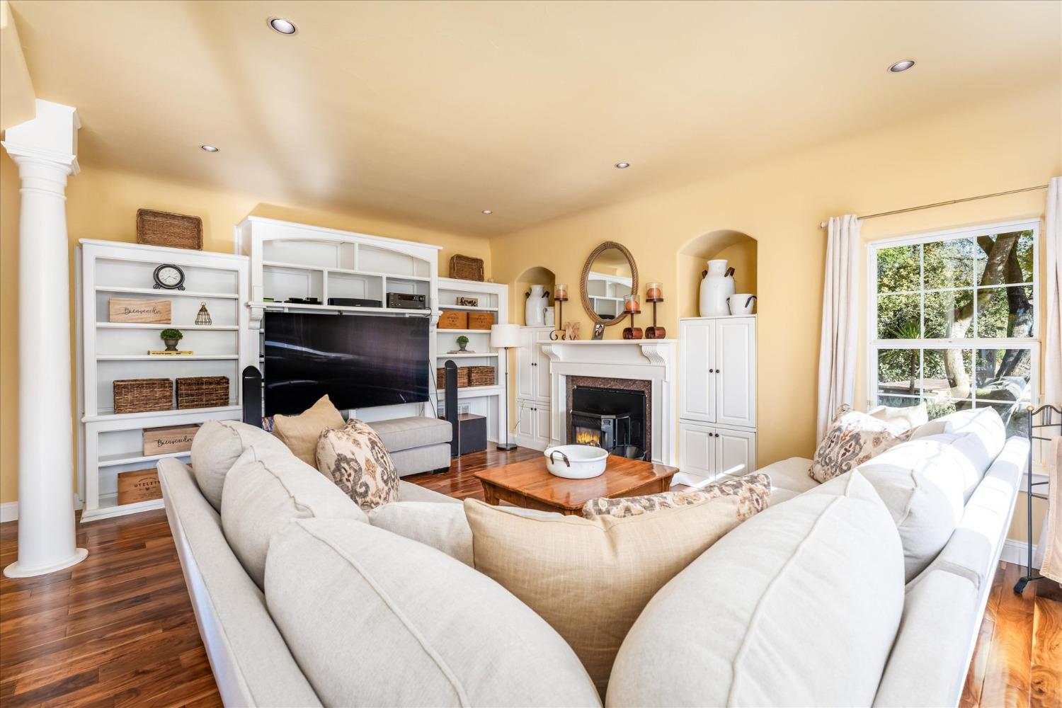 28853 Limestone Way Coarsegold, CA 93614 - Photo 15 of 54 a living room with furniture fireplace and a flat screen tv