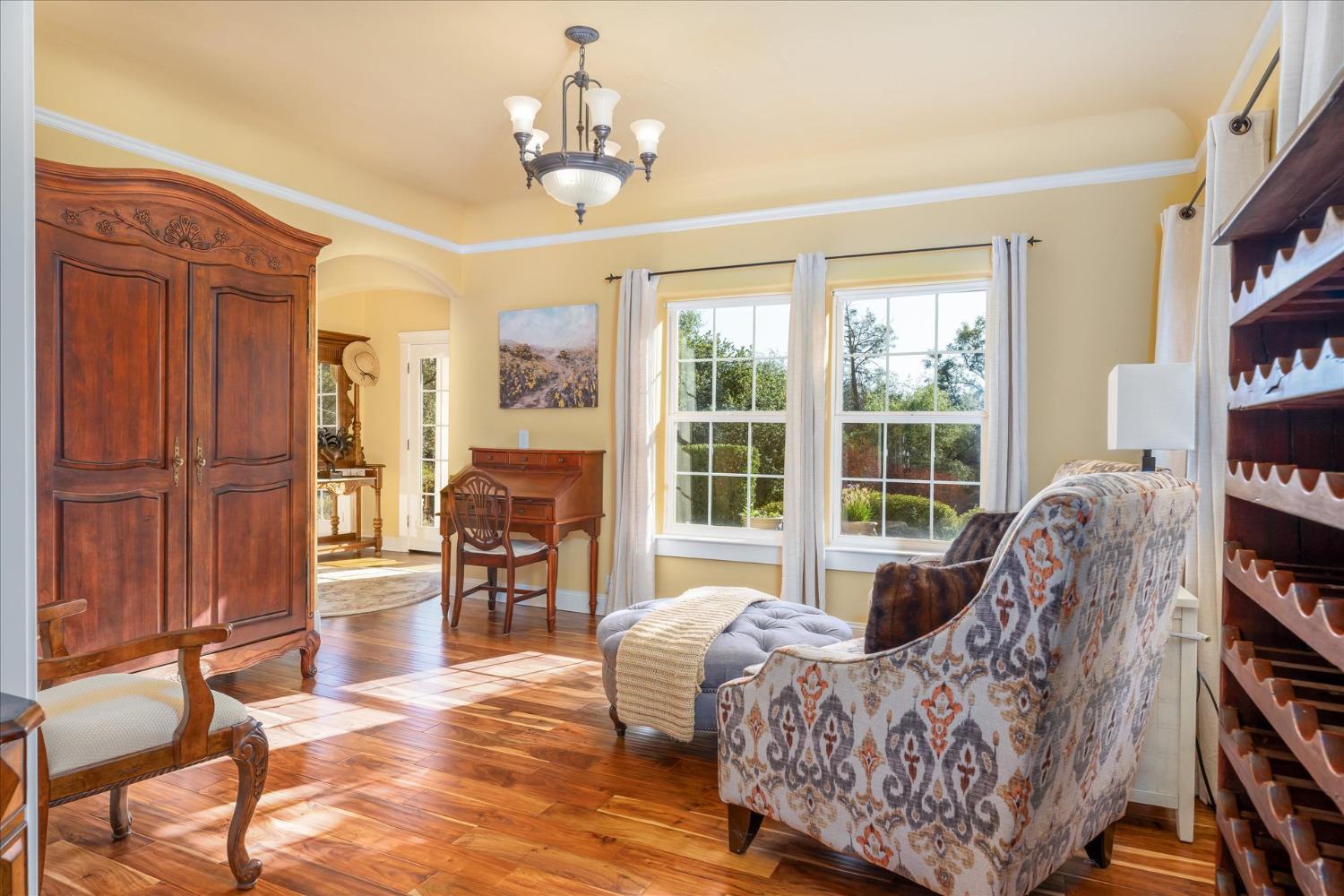 28853 Limestone Way Coarsegold, CA 93614 - Photo 20 of 54 a living room with furniture a bookshelf and a window