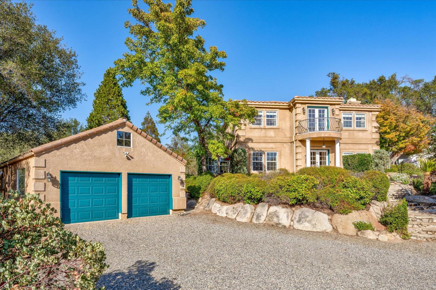 28853 Limestone Way Coarsegold, CA 93614 - Photo 2 of 54 a front view of a house with a yard and garage