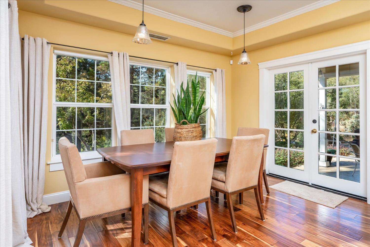 28853 Limestone Way Coarsegold, CA 93614 - Photo 21 of 54 a view of a dining room with furniture window and wooden floor