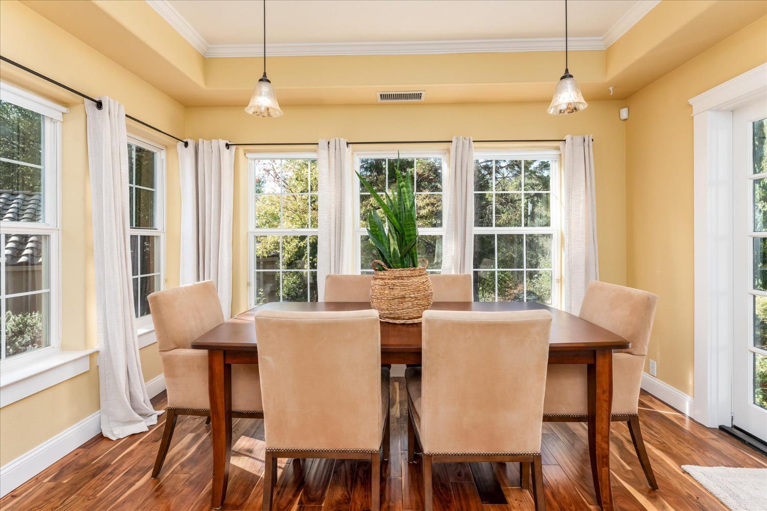 28853 Limestone Way Coarsegold, CA 93614 - Photo 22 of 54 a view of a dining room with furniture windows and wooden floor