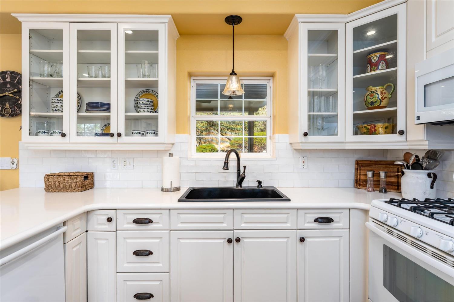 28853 Limestone Way Coarsegold, CA 93614 - Photo 25 of 54 a kitchen with a stove a sink and a microwave