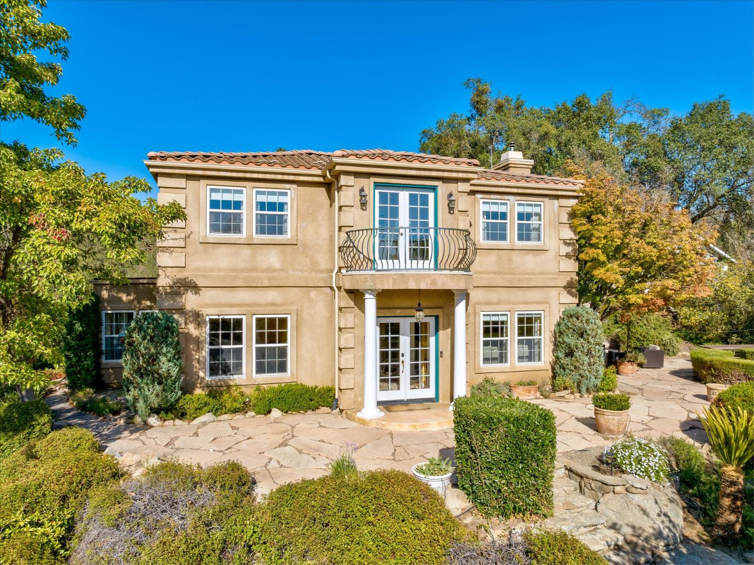 28853 Limestone Way Coarsegold, CA 93614 - Photo 3 of 54 a front view of a house with a yard