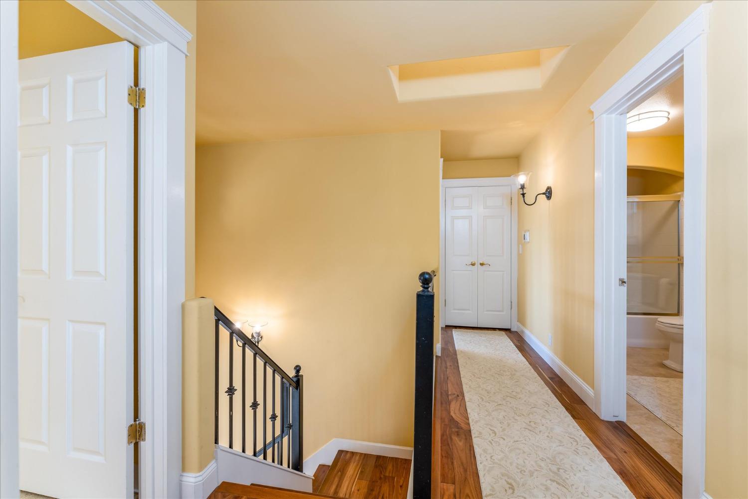 28853 Limestone Way Coarsegold, CA 93614 - Photo 36 of 54 a view of a hallway with wooden floor and staircase