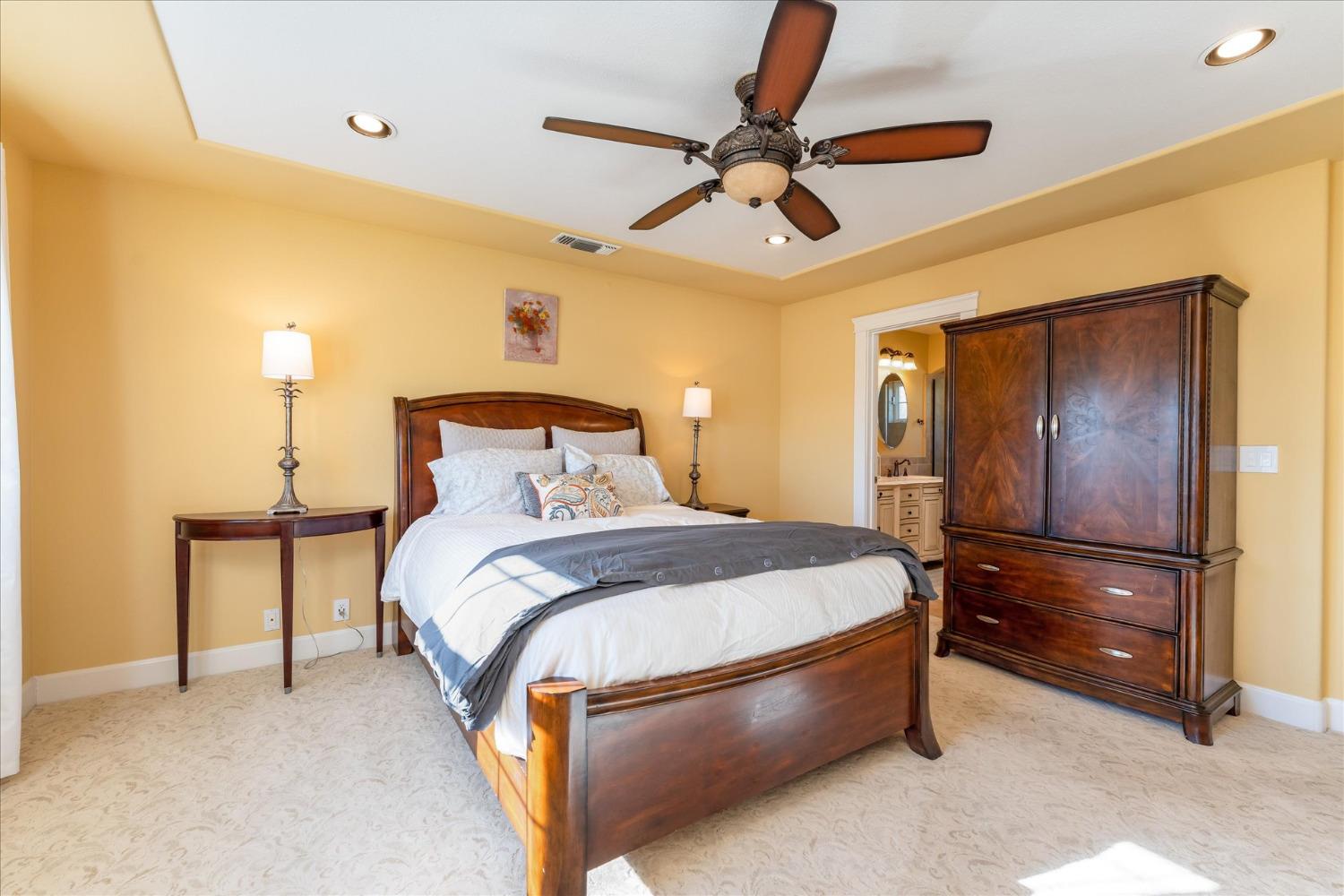28853 Limestone Way Coarsegold, CA 93614 - Photo 39 of 54 a bedroom with a bed and ceiling fan
