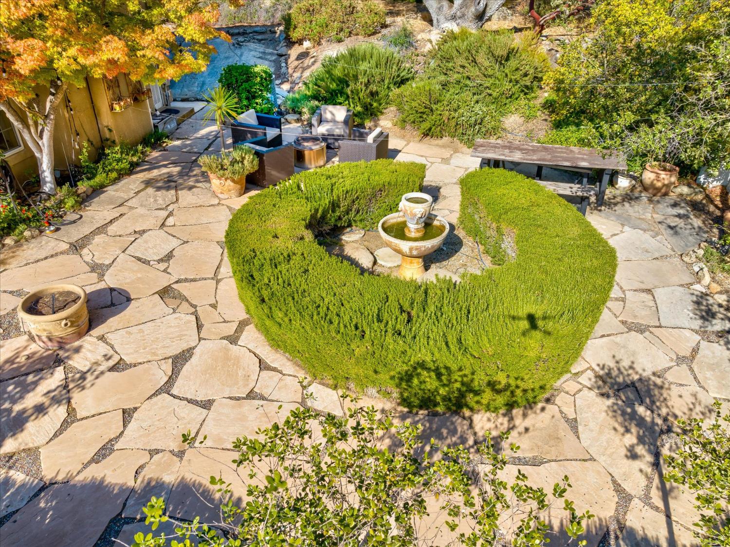 28853 Limestone Way Coarsegold, CA 93614 - Photo 46 of 54 a view of a swimming pool with a dining table and chairs