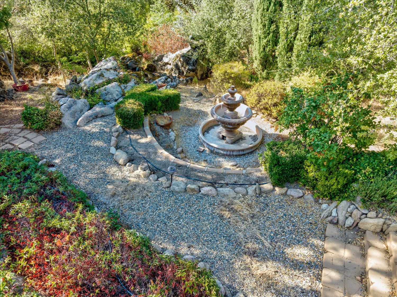 28853 Limestone Way Coarsegold, CA 93614 - Photo 50 of 54 a view of a backyard with table and chairs