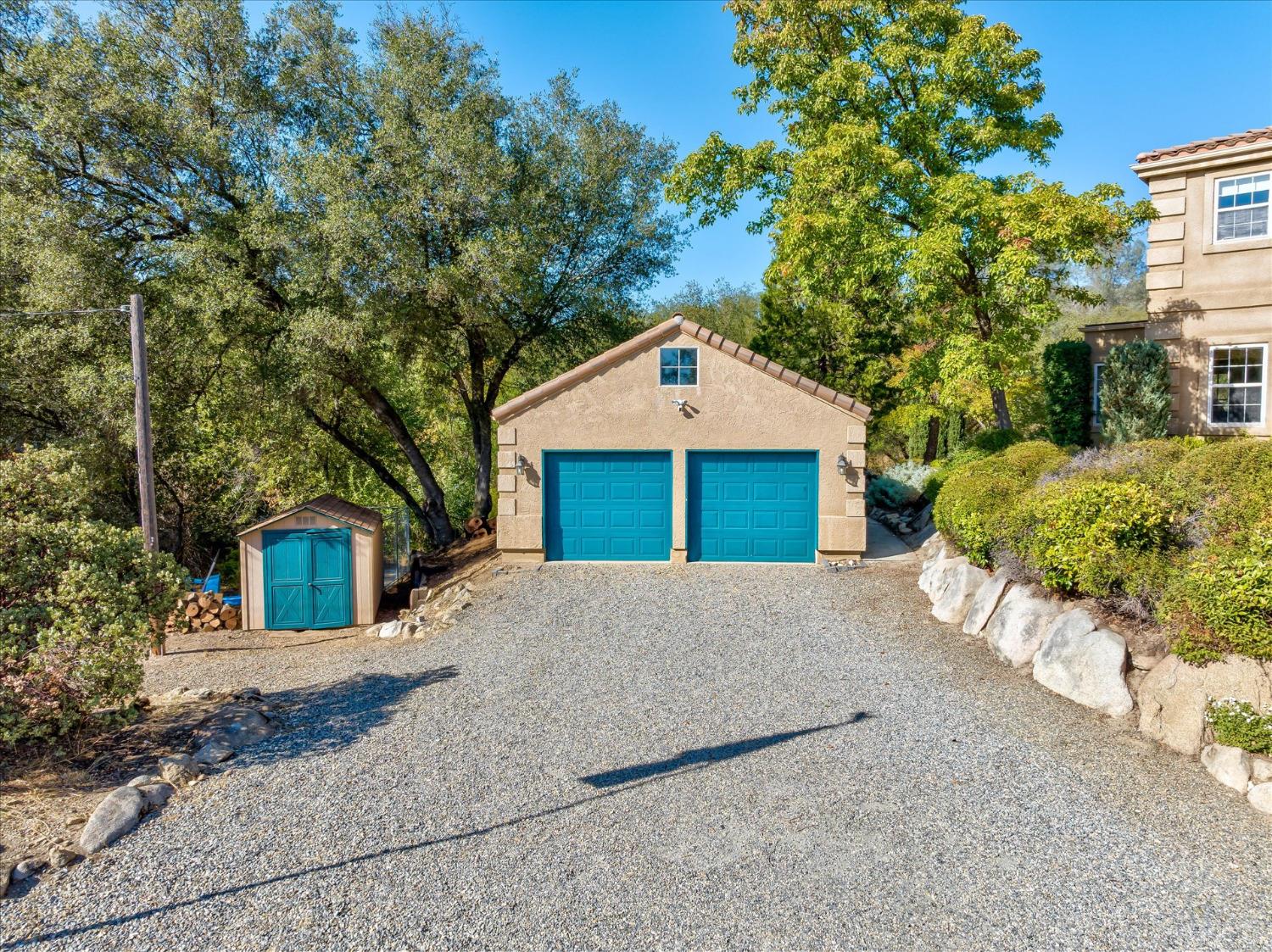 28853 Limestone Way Coarsegold, CA 93614 - Photo 51 of 54 a front view of a house with a yard and garage