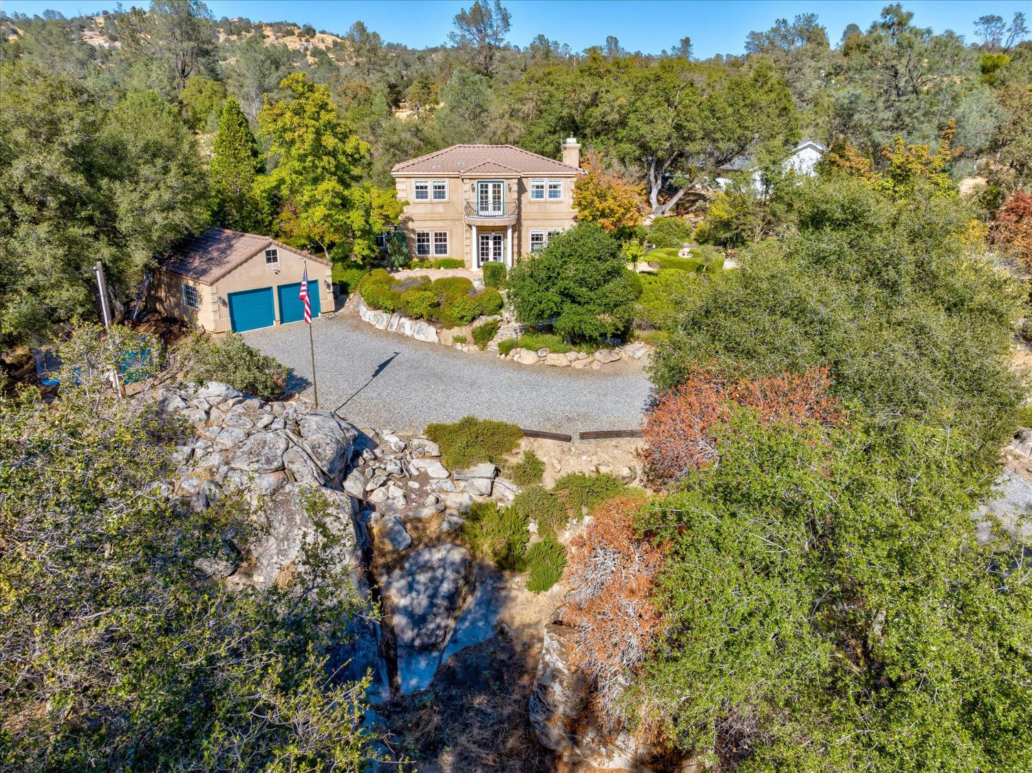 28853 Limestone Way Coarsegold, CA 93614 - Photo 7 of 54 a view of a house with a yard