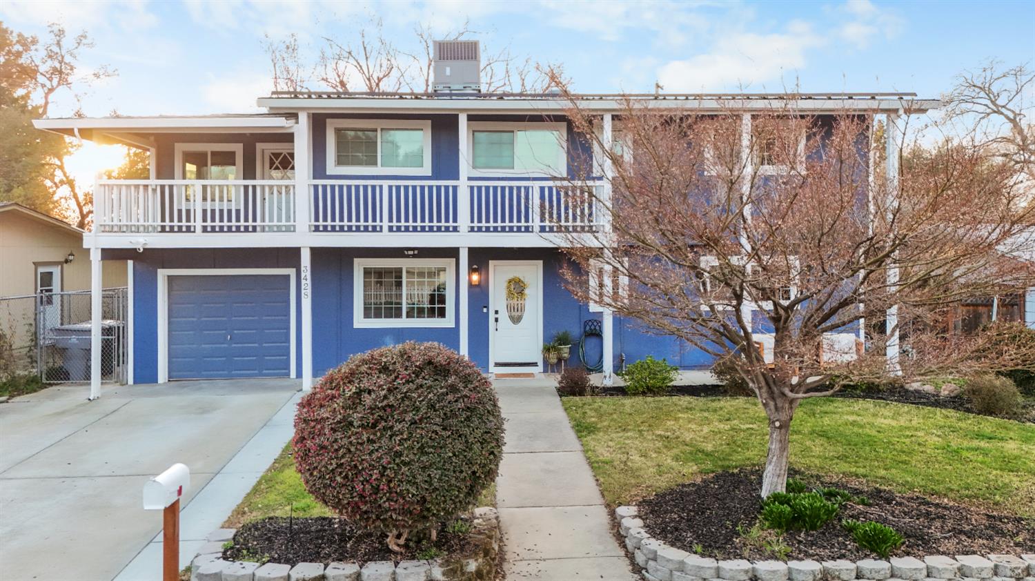 a front view of a house with garden