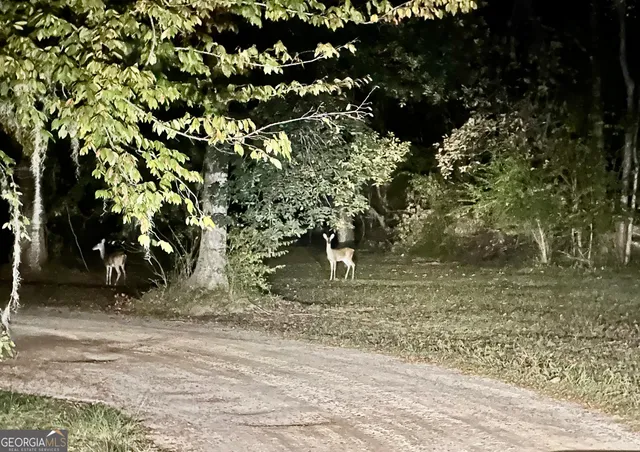 a view of swimming pool with an outdoor space and seating area