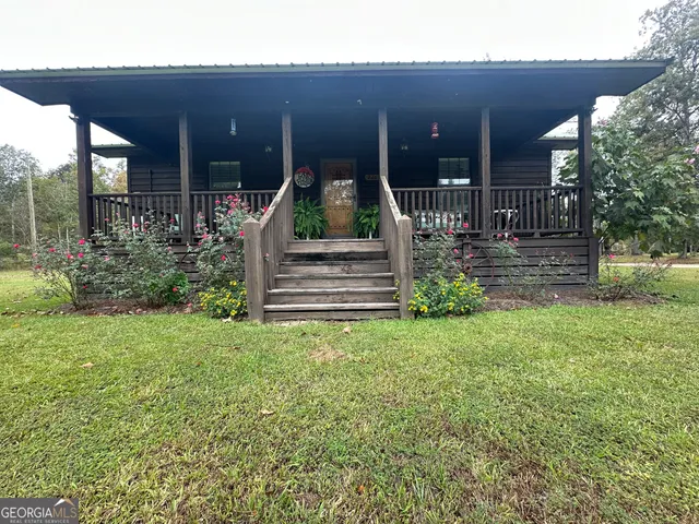 a view of a yard with large trees