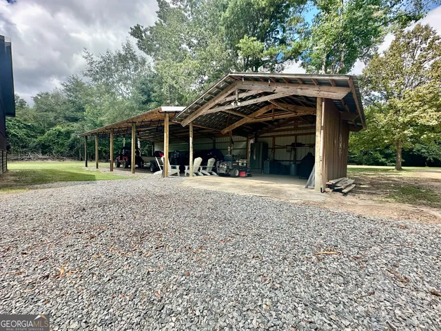 a view of a swimming pool with a yard