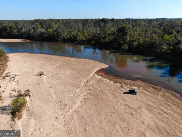 a view of a tree in front of a yard