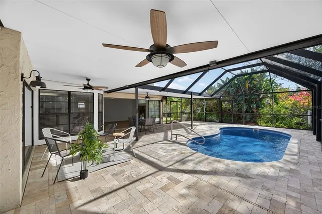a view of a patio with a table and chairs