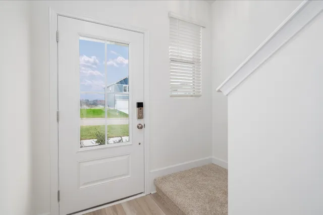 an empty room with a empty space and a ceiling fan