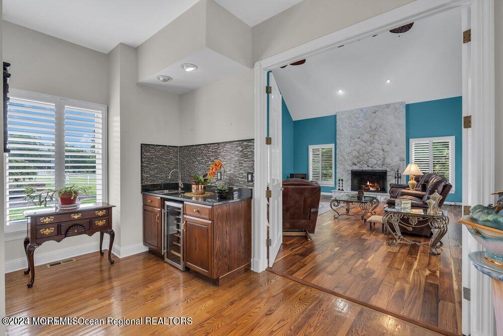65 Cross Road Colts Neck, NJ 07722 - Photo 12 of 21 a living room with furniture and a fireplace