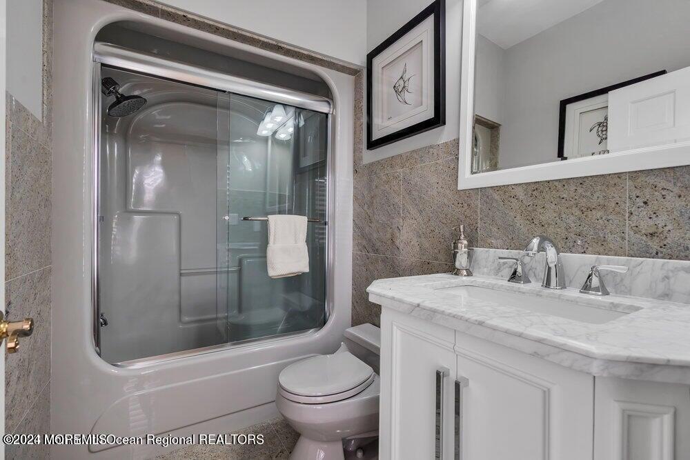 65 Cross Road Colts Neck, NJ 07722 - Photo 16 of 21 a bathroom with a sink a toilet and shower