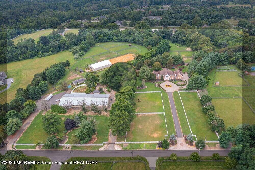 65 Cross Road Colts Neck, NJ 07722 - Photo 3 of 21 an aerial view of residential house with outdoor space and swimming pool